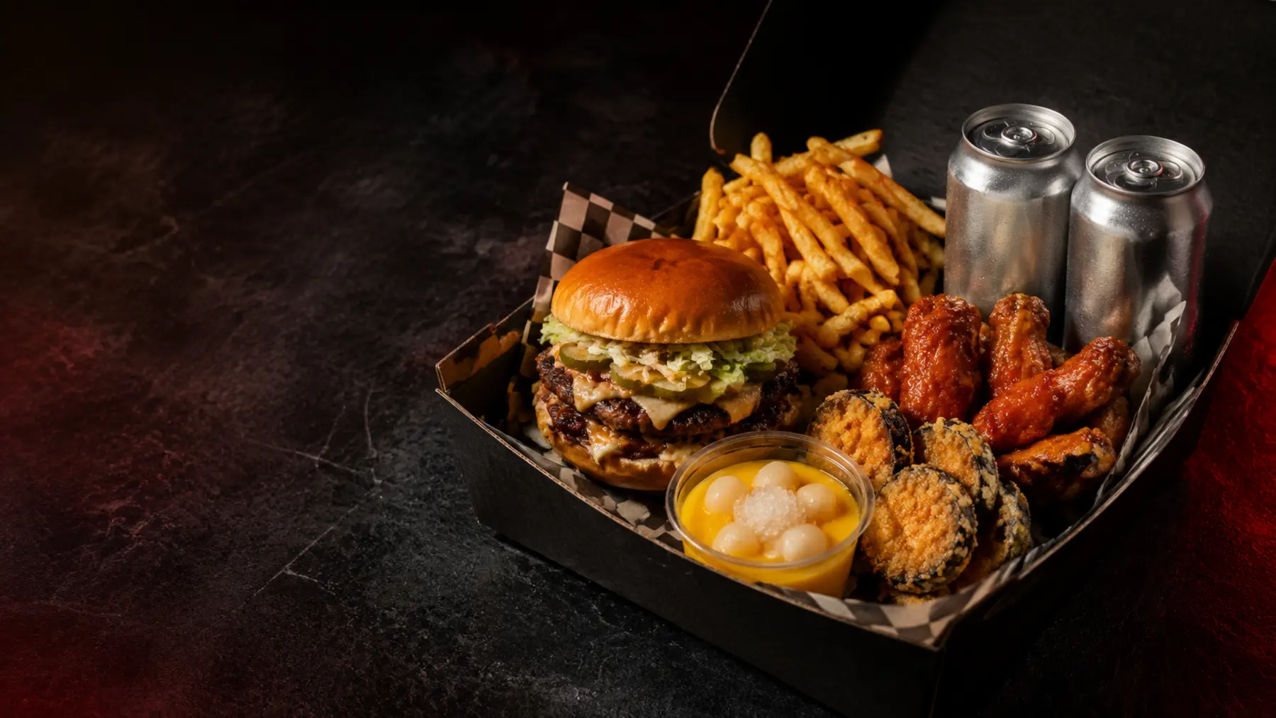 Beast Box with burger, fries, wings, eggplant bites and dessert